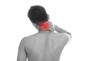 Young man holding back pain bone spine on a white background