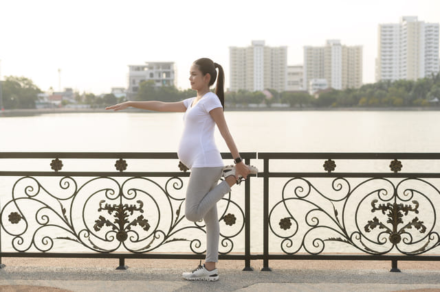 beautiful-pregnant-woman-stretching-and-exercising